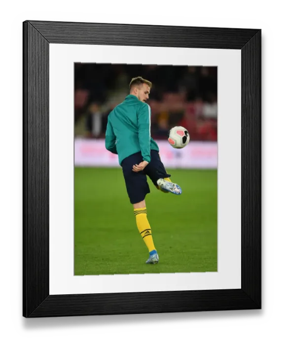 Framed Print : Arsenal's Rob Holding Gears Up for Sheffield United Clash in Premier League (2019-20)