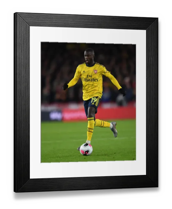 Framed Print : Nicolas Pepe in Action for Arsenal against Sheffield United