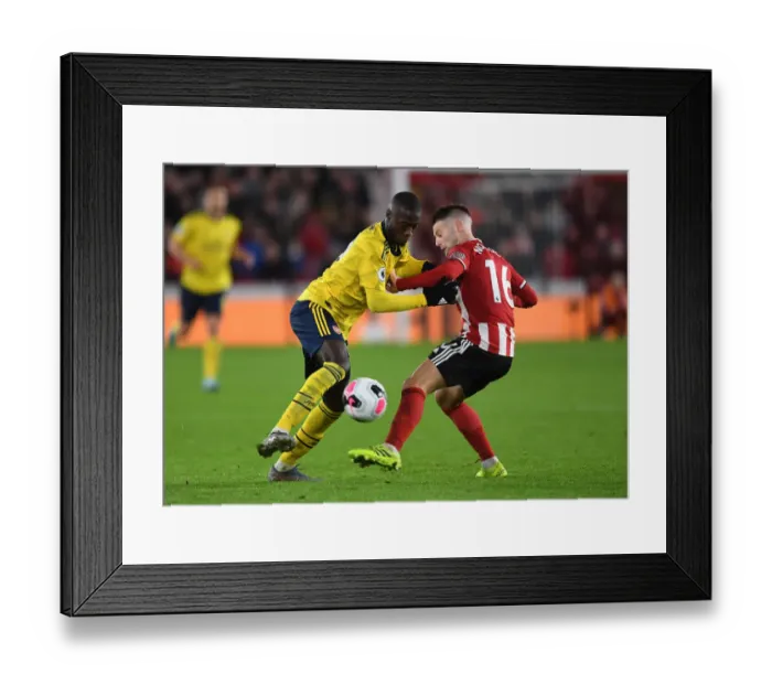 Framed Print : Pepe vs Norwood: Clash at Bramall Lane - Sheffield United vs Arsenal, Premier League 2019-20 Framed Print : Pepe vs Norwood: Clash at Bramall Lane - Sheffield United vs Arsenal, Premier League 2019-20
