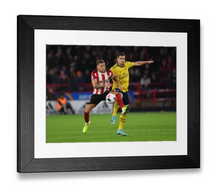 Framed Print : Sokratis vs. Billy Sharp: Intense Battle at Bramall Lane - Sheffield United vs. Arsenal, Premier League 2019-20