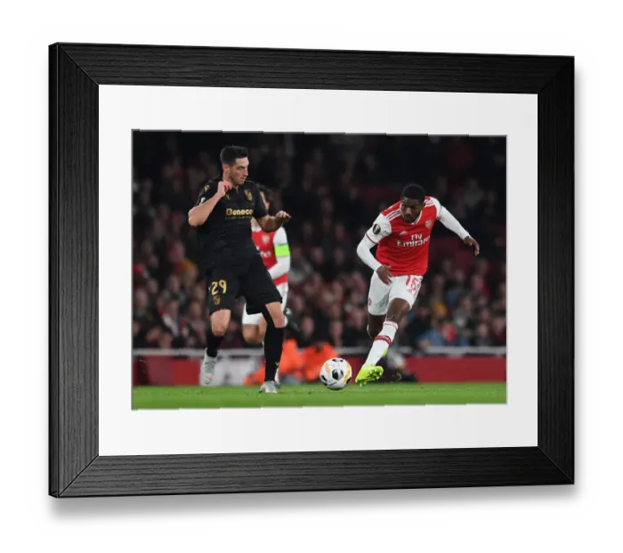 Framed Print : Arsenal vs. Vitoria Guimaraes: Tense Battle in UEFA Europa League Group F