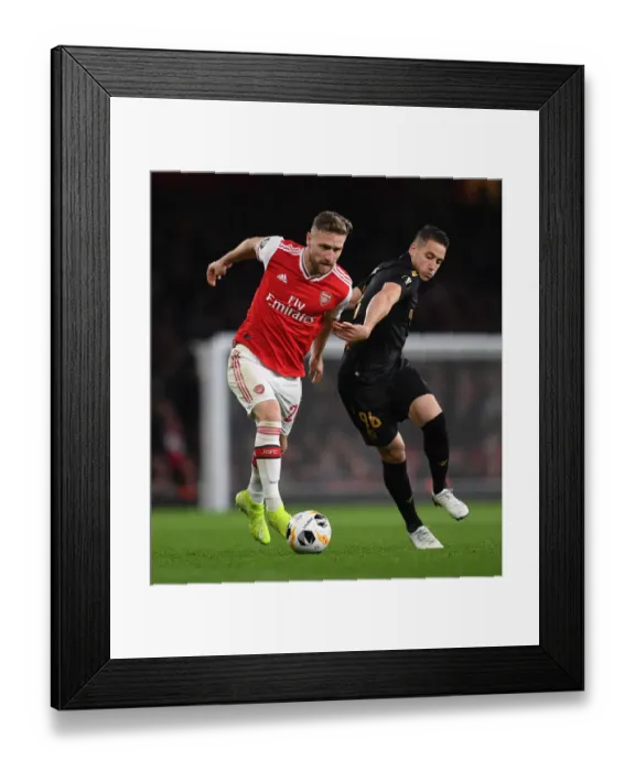 Framed Print : Mustafi vs Duarte: A Central Battle in Arsenal's Europa League Clash against Vitoria Guimaraes Framed Print : Mustafi vs Duarte: A Central Battle in Arsenal's Europa League Clash against Vitoria Guimaraes