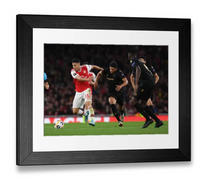 Framed Print : Arsenal's Martinelli Clashes with Vitoria's Poha in Europa League Showdown