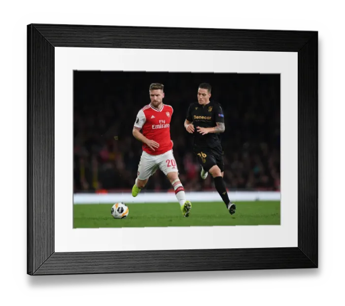 Framed Print : Arsenal vs. Vitoria Guimaraes: Mustafi Clashes with Duarte in Europa League Showdown