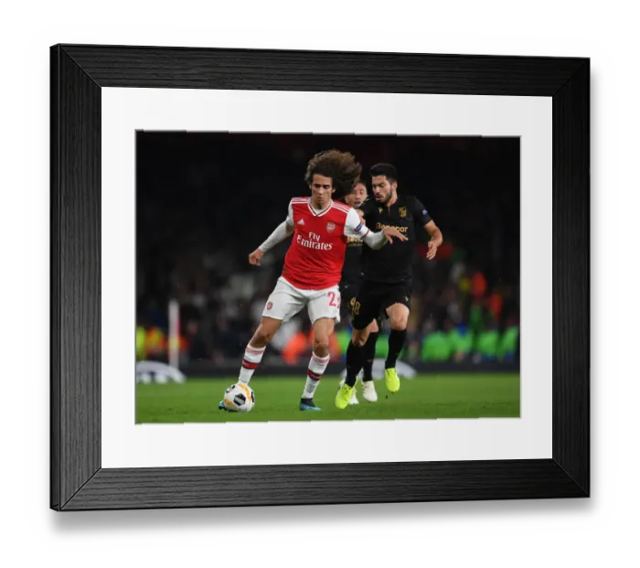Framed Print : Guendouzi vs. Pepe: Clash of the Europa League Titans at Arsenal's Emirates Stadium
