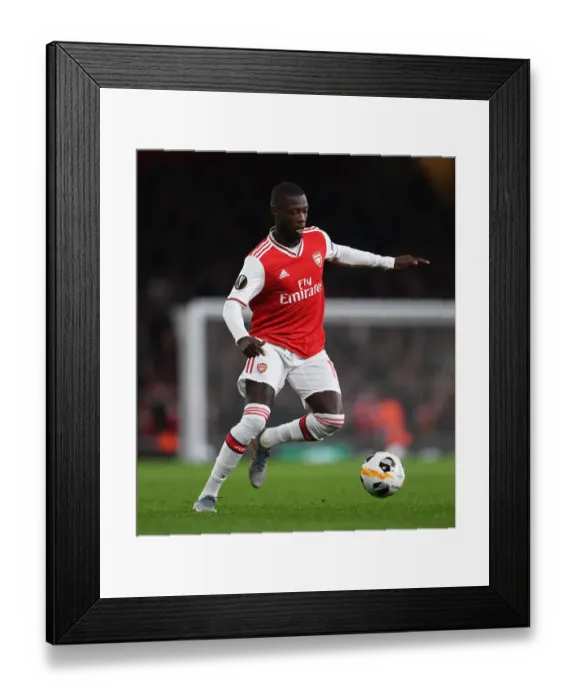 Framed Print : Arsenal's Nicolas Pepe in Action: Arsenal vs. Vitoria Guimaraes, UEFA Europa League 2019-20