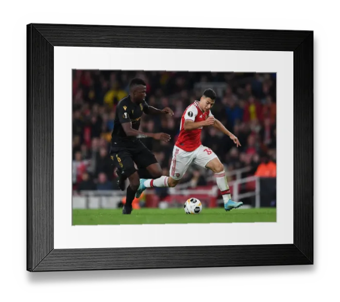 Framed Print : Arsenal's Martinelli Clashes with Vitoria's Tapsoba in Europa League Showdown Framed Print : Arsenal's Martinelli Clashes with Vitoria's Tapsoba in Europa League Showdown