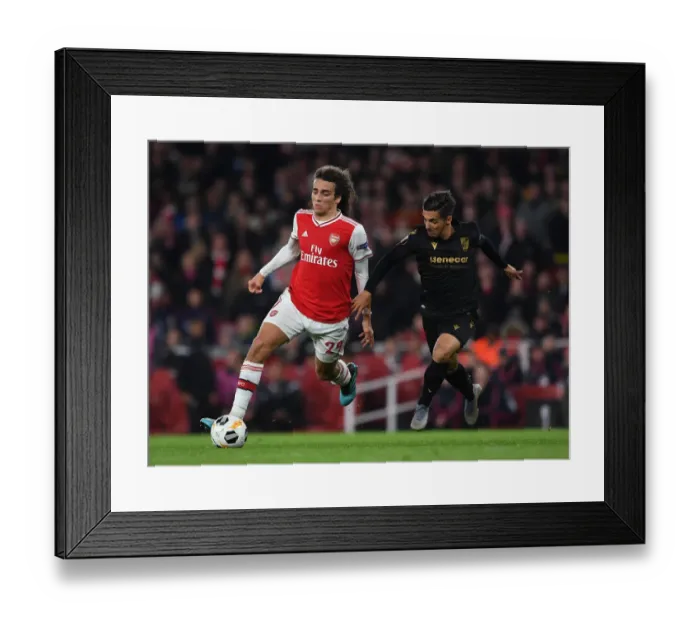 Framed Print : Guendouzi vs. Rochinha: A Battle in Arsenal's Europa League Clash against Vitoria Guimaraes Framed Print : Guendouzi vs. Rochinha: A Battle in Arsenal's Europa League Clash against Vitoria Guimaraes