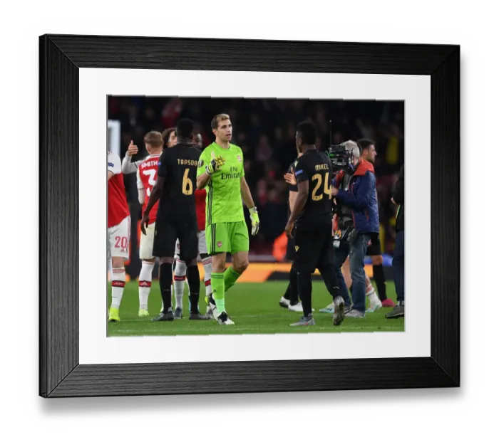 Framed Print : Arsenal's Emi Martinez and Mikel Agu Share a Moment after Arsenal v Vitoria Europa League Clash