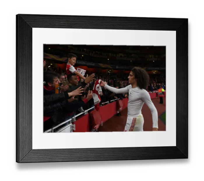 Framed Print : Arsenal's Guendouzi Delights Fan with Shirt Gift after Europa League Triumph
