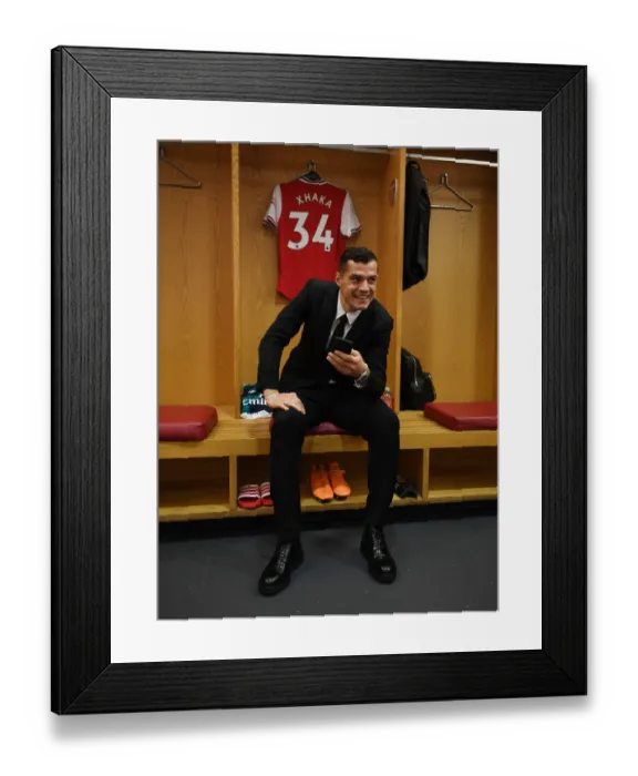 Framed Print : Granit Xhaka's Focus and Determination: Arsenal Changing Room Before Arsenal vs Crystal Palace (2019-20)
