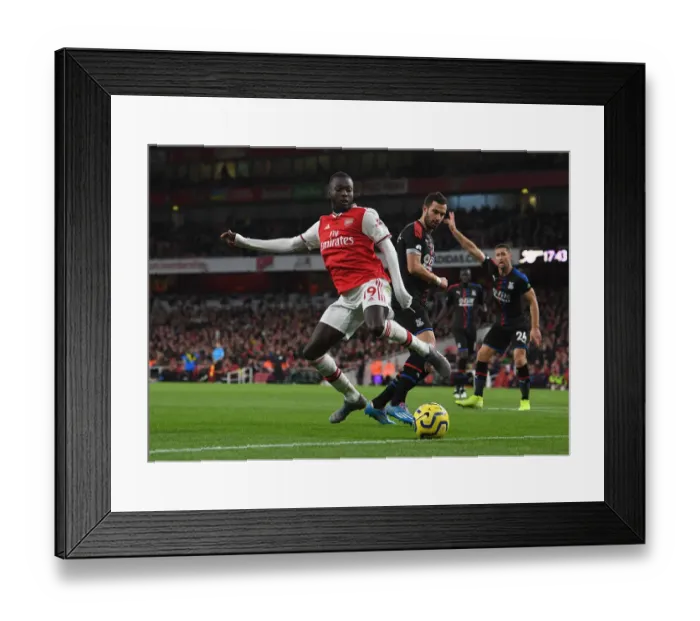 Framed Print : Arsenal's Pepe Faces Off Against Palace's Milivojevic in Premier League Clash