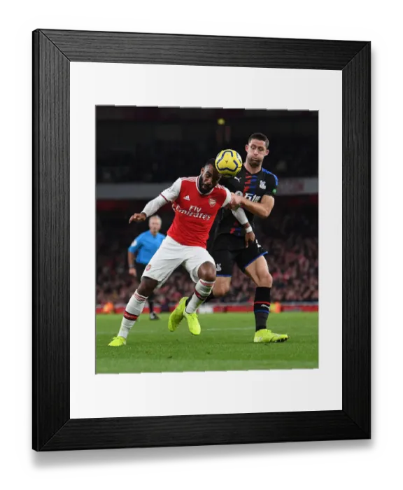 Framed Print : Arsenal vs Crystal Palace: Lacazette Faces Off Against Cahill in Intense Premier League Clash