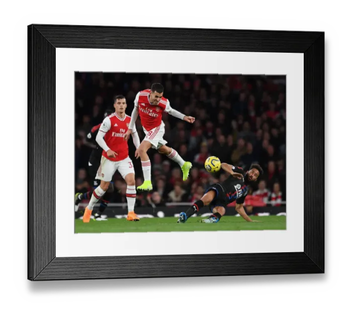 Framed Print : Arsenal vs Crystal Palace: Ceballos Heads a Contested Ball in Premier League Clash