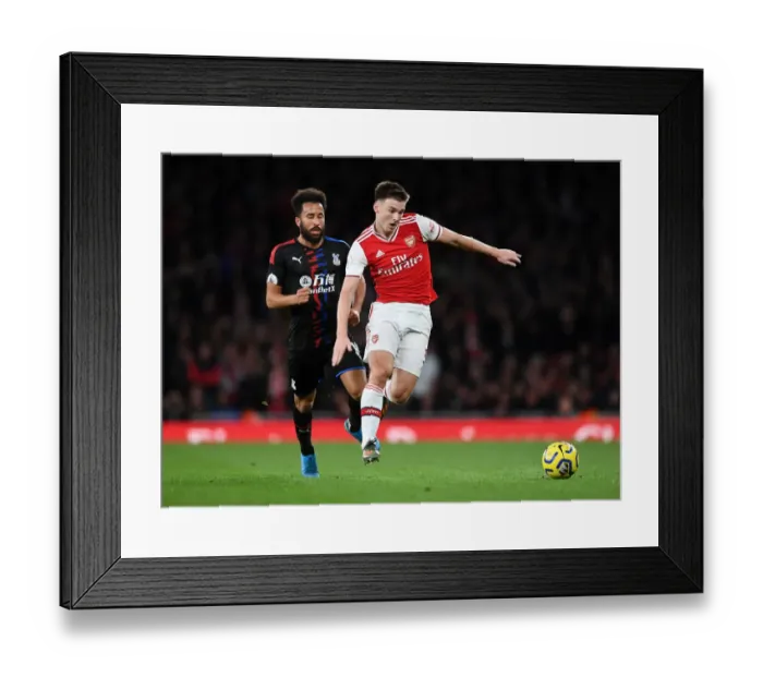 Framed Print : Arsenal's Kieran Tierney Clashes with Andros Townsend in the Premier League Showdown between Arsenal and Crystal Palace