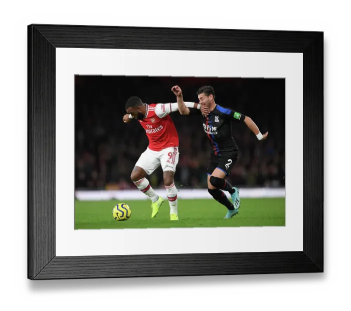 Framed Print : Arsenal's Lacazette Faces Off Against Palace's Ward in Premier League Clash Framed Print : Arsenal's Lacazette Faces Off Against Palace's Ward in Premier League Clash
