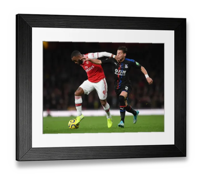 Framed Print : Arsenal's Lacazette Fends Off Palace's Ward in Premier League Clash