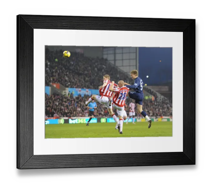Framed Print : Nicklas Bendtner heads past Ryan Shawcross and Andy Wilkinson to score the 1st Arsenal goal