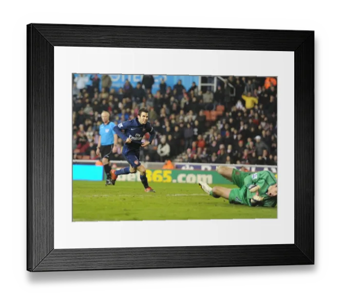Framed Print : Cesc Fabregas Scores Stunner Past Stoke's Sorensen: Arsenal Cruises to 3-1 Victory Framed Print : Cesc Fabregas Scores Stunner Past Stoke's Sorensen: Arsenal Cruises to 3-1 Victory