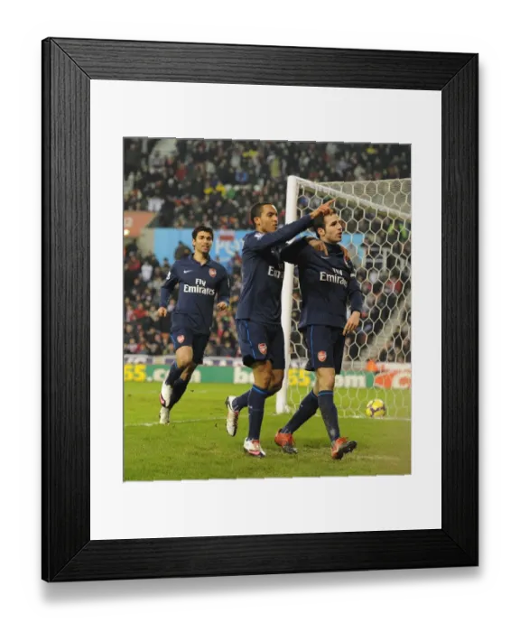 Framed Print : Cesc Fabregas's Brilliant Double: Arsenal Triumph Over Stoke 3-1, Walcott and Eduardo Celebrate