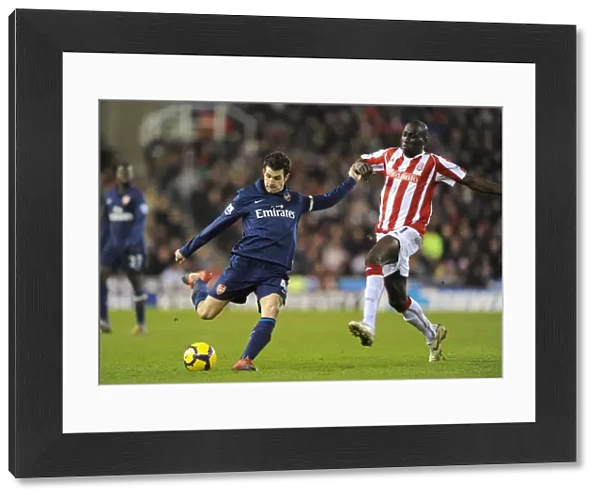 Cesc Fabregas (Arsenal) Mamady Sidibe (Stoke). Stoke City 1: 3 Arsenal, Barclays Premier League
