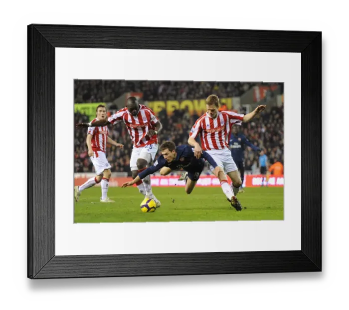 Framed Print : Ramsey's Brilliant Performance: Arsenal Overpower Stoke's Shawcross and Faye (3-1) Framed Print : Ramsey's Brilliant Performance: Arsenal Overpower Stoke's Shawcross and Faye (3-1)