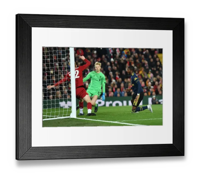 Framed Print : Ainsley Maitland-Niles Stuns Liverpool: Arsenal's Shocking Carabao Cup Goal at Anfield