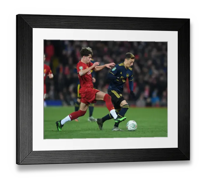 Framed Print : Mesut Ozil vs. Neco Williams: A Battle at Anfield in the Carabao Cup