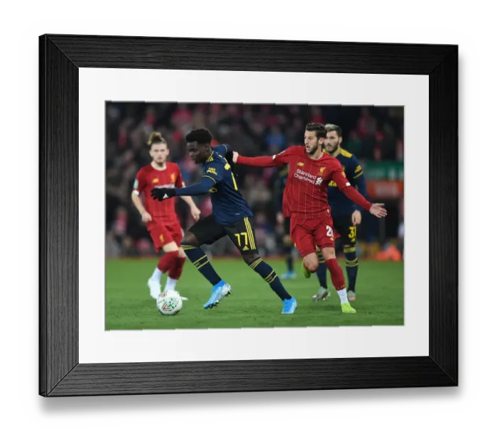 Framed Print : Bukayo Saka vs. Adam Lallana: Carabao Cup Showdown - Liverpool vs. Arsenal Framed Print : Bukayo Saka vs. Adam Lallana: Carabao Cup Showdown - Liverpool vs. Arsenal