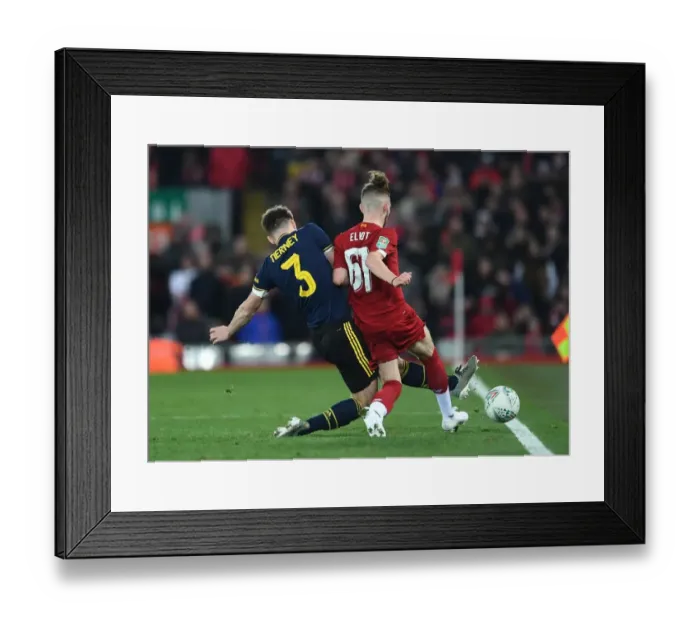 Framed Print : Arsenal's Kieran Tierney Tackles Liverpool's Harvey Elliott in Carabao Cup Clash
