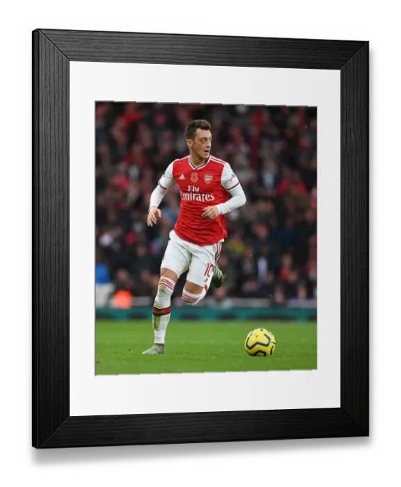 Framed Print : Arsenal's Ozil Faces Off Against Wolverhampton Wanderers in Premier League Showdown