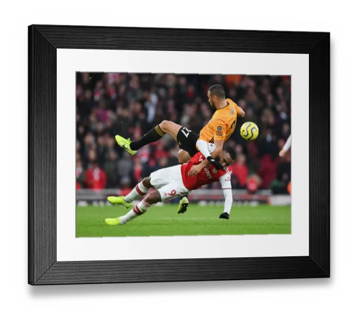 Framed Print : Intense Battle: Lacazette vs. Saiss - Arsenal vs. Wolverhampton Wanderers, Premier League 2019-20