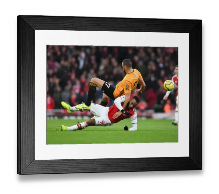 Framed Print : Lacazette vs. Saiss: A Premier League Battle at the Emirates