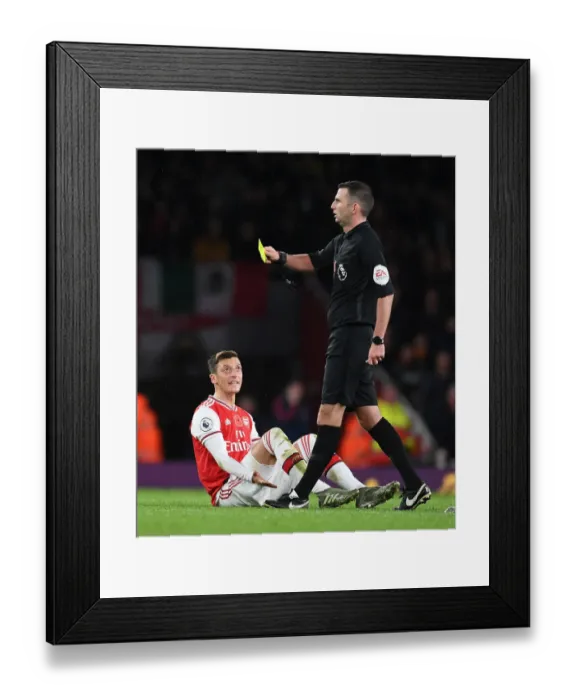 Framed Print : Arsenal's Mesut Ozil Argues with Referee during Arsenal v Wolverhampton Wanderers Premier League Match Framed Print : Arsenal's Mesut Ozil Argues with Referee during Arsenal v Wolverhampton Wanderers Premier League Match