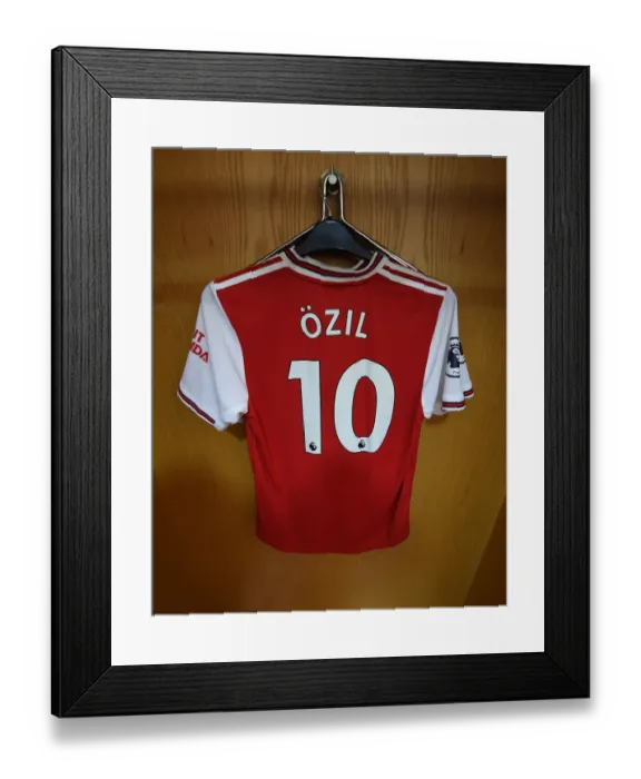 Framed Print : Arsenal FC vs. Wolverhampton Wanderers: Mesut Ozil's Empty Shirt in Arsenal's Home Changing Room (2019-20)