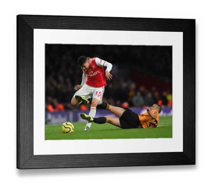 Framed Print : Martinelli Fouled by Saiss in Arsenal vs. Wolverhampton (2019-20 Premier League) Framed Print : Martinelli Fouled by Saiss in Arsenal vs. Wolverhampton (2019-20 Premier League)