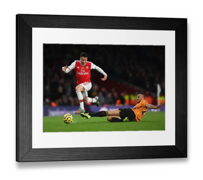 Framed Print : Martinelli Foul: Arsenal's Star Forward Halted by Saiss in Arsenal vs. Wolverhampton Clash (2019-20) Framed Print : Martinelli Foul: Arsenal's Star Forward Halted by Saiss in Arsenal vs. Wolverhampton Clash (2019-20)