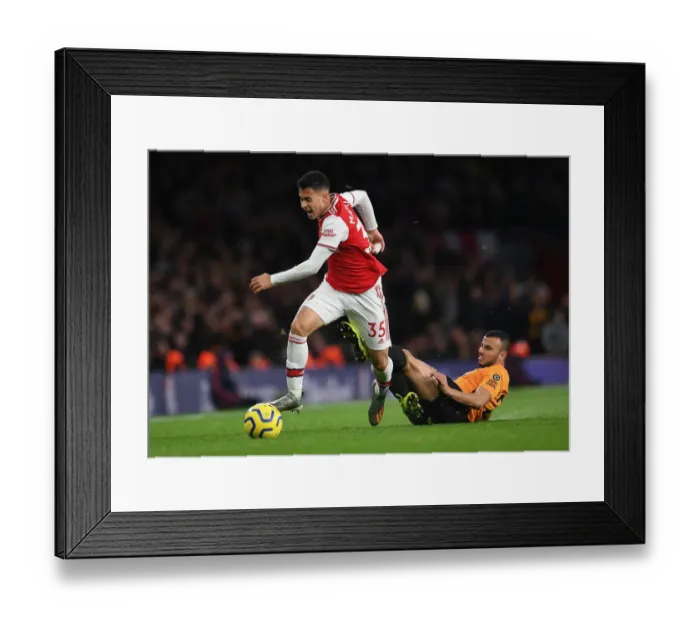 Framed Print : Martinelli Foul: Arsenal's Rising Star Halted by Saiss in Arsenal vs. Wolverhampton (2019-20) Framed Print : Martinelli Foul: Arsenal's Rising Star Halted by Saiss in Arsenal vs. Wolverhampton (2019-20)