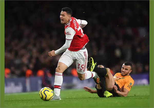 Martinelli Foul: Arsenal's Star Forward Halted by Saiss in Arsenal vs. Wolverhampton Clash (2019-20)