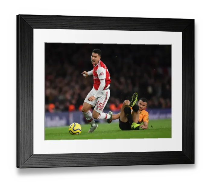 Framed Print : Martinelli Foul: Arsenal's Rising Star Halted by Saiss in Arsenal vs. Wolverhampton (2019-20)