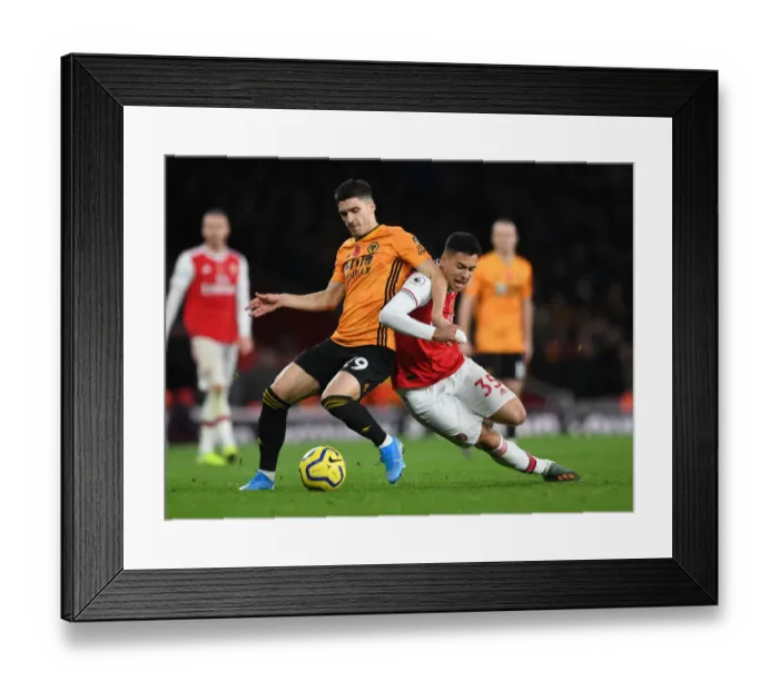 Framed Print : Martinelli Foul: Arsenal's Star Forward Halted by Vinagre in Arsenal vs. Wolverhampton Clash (November 2019)