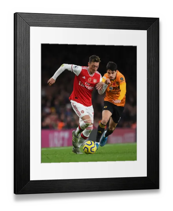 Framed Print : Ozil vs. Neto: Clash of the Playmakers in Arsenal vs. Wolverhampton Wanderers Premier League Showdown (November 2019) Framed Print : Ozil vs. Neto: Clash of the Playmakers in Arsenal vs. Wolverhampton Wanderers Premier League Showdown (November 2019)