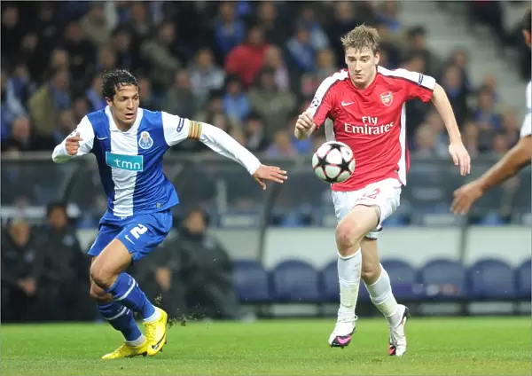 Nicklas Bendtner (Arsenal) Bruno Alves (Porto). FC Porto 2: 1 Arsenal, UEFA Champions League