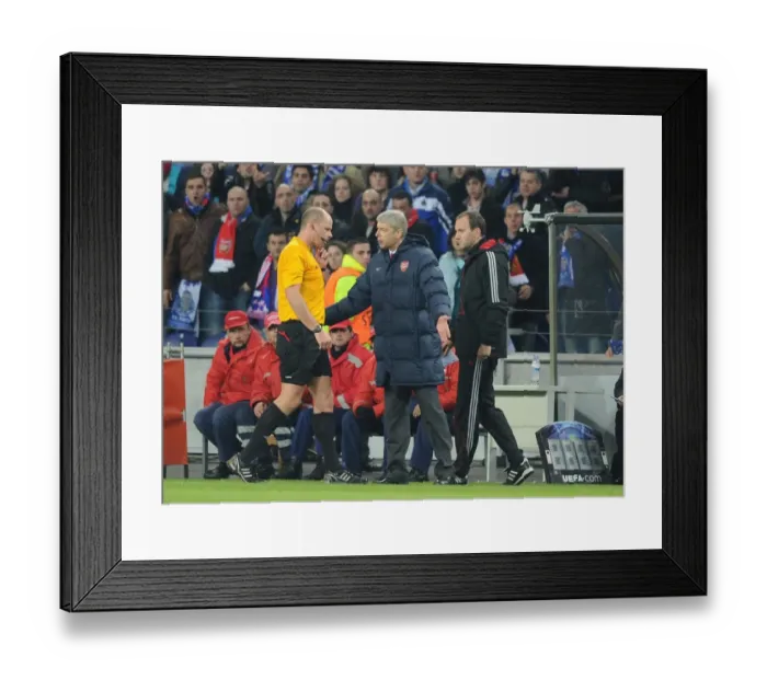 Framed Print : Arsenal manager Arsene Wenger talks to referee Martin Hansson after the 2nd Porto goal Framed Print : Arsenal manager Arsene Wenger talks to referee Martin Hansson after the 2nd Porto goal
