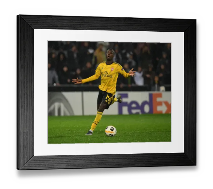 Framed Print : Nicolas Pepe in Action: Arsenal's Star Performer Shines in Europa League Clash against Vitoria Guimaraes