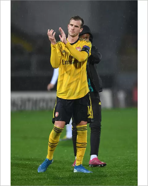 Arsenal's Rob Holding Celebrates with Fans after Europa League Victory over Vitoria Guimaraes