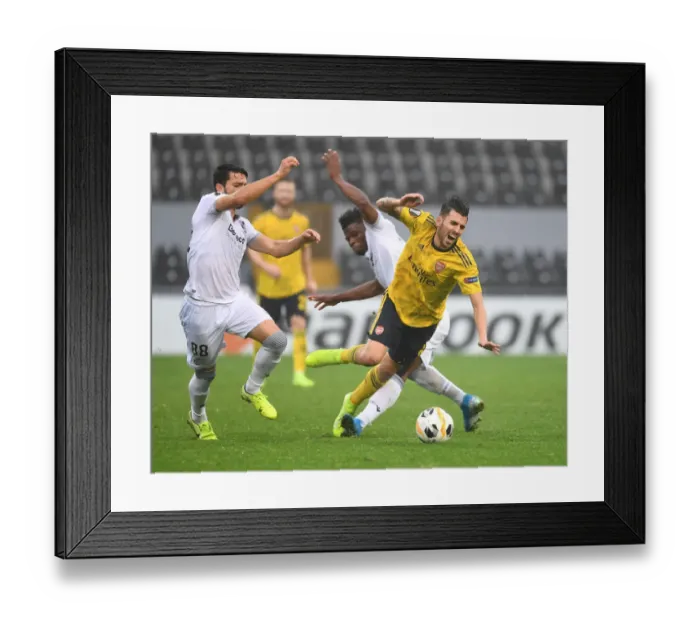 Framed Print : Dani Ceballos vs Mikel Agu: Intense Clash in Vitoria Guimaraes vs Arsenal UEFA Europa League Match