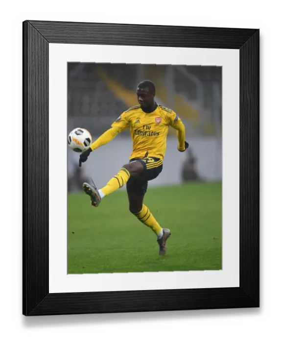 Framed Print : Arsenal's Nicolas Pepe in Action: Europa League Clash against Vitoria Guimaraes, 2019-2020 Framed Print : Arsenal's Nicolas Pepe in Action: Europa League Clash against Vitoria Guimaraes, 2019-2020
