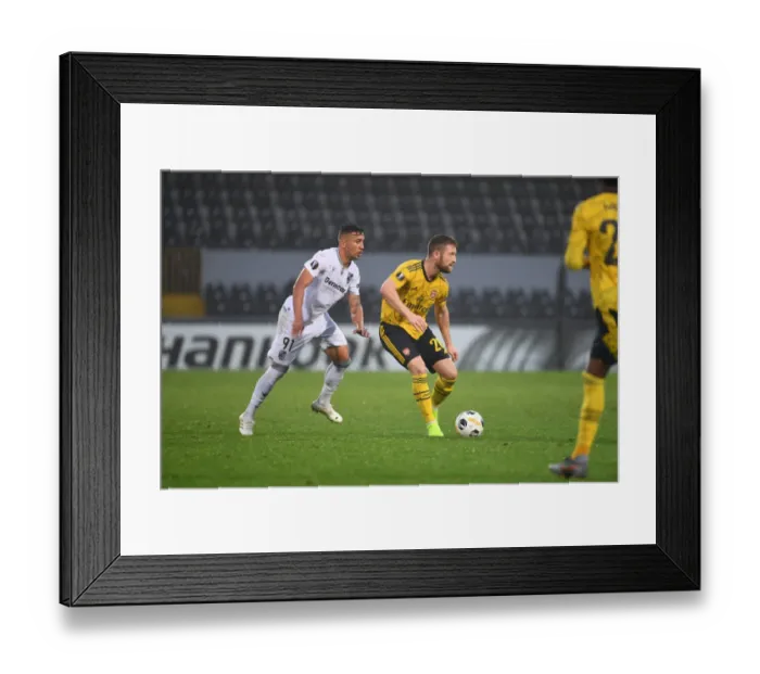 Framed Print : Mustafi's Brave Run: Arsenal's Thrilling Europa League Win over Vitoria Framed Print : Mustafi's Brave Run: Arsenal's Thrilling Europa League Win over Vitoria