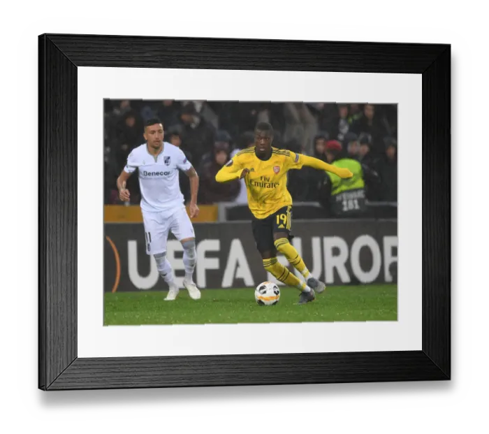 Framed Print : Nicolas Pepe Shines: Arsenal's Breakout Star in Europa League Victory over Vitoria Guimaraes